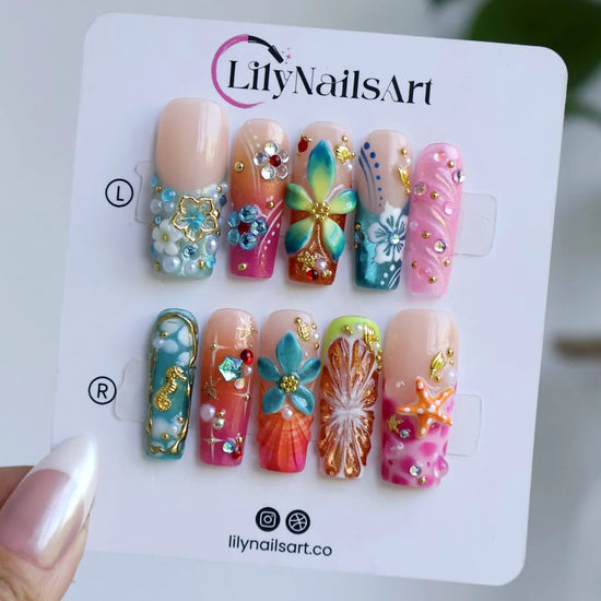 Bellini handmade summer press-on nails — maximalist long square set with 3D hibiscus, seahorse, starfish and shells in coral pink and teal
