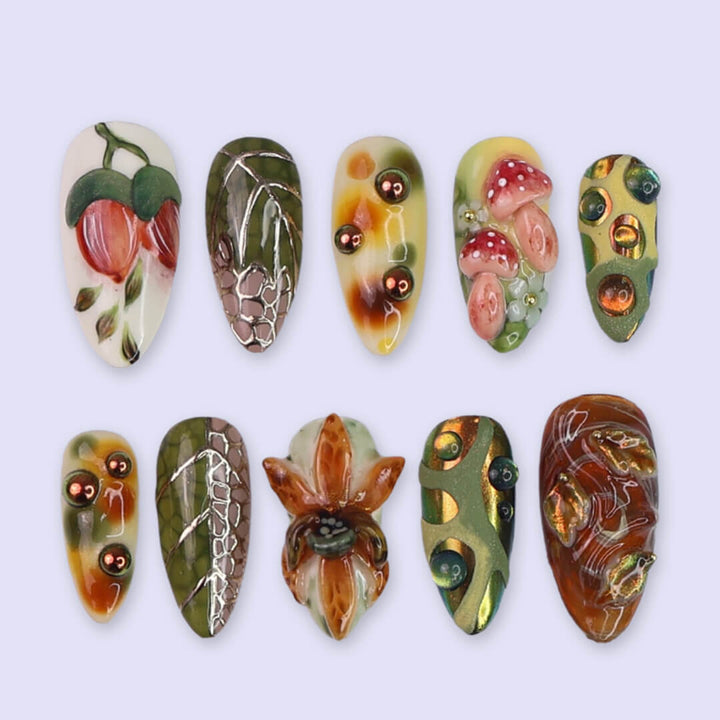 3D forest-inspired press-on nails with sculpted mushrooms, fruits, metallic leaves, and organic earthy textures in amber, moss green, and deep brown tones — luxury handmade long almond nails — perfect for autumn styles, enchanted woodland looks, or mystical nail art for fall