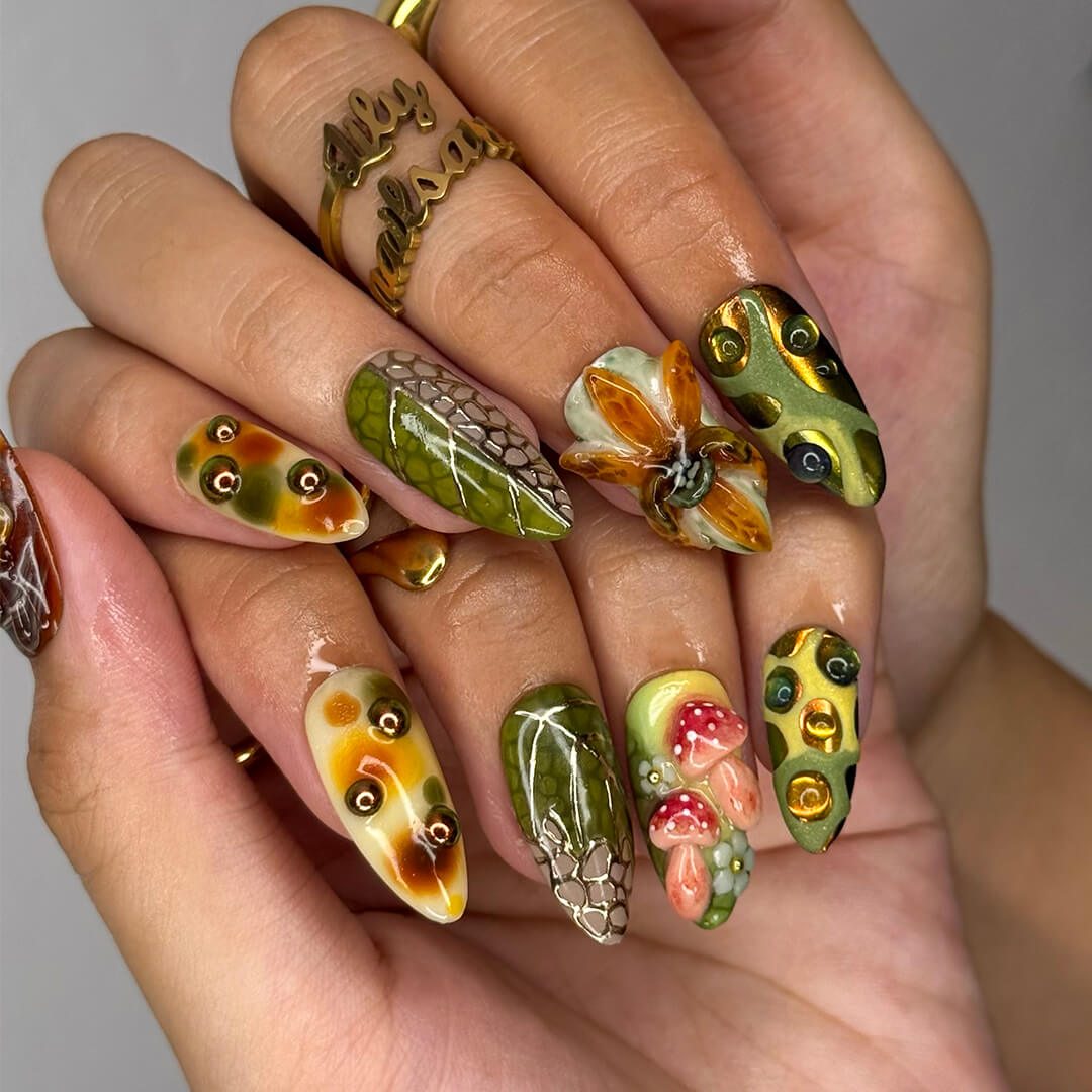 3D forest-inspired press-on nails with sculpted mushrooms, fruits, metallic leaves, and organic earthy textures in amber, moss green, and deep brown tones — luxury handmade long almond nails — perfect for autumn styles, enchanted woodland looks, or mystical nail art for fall