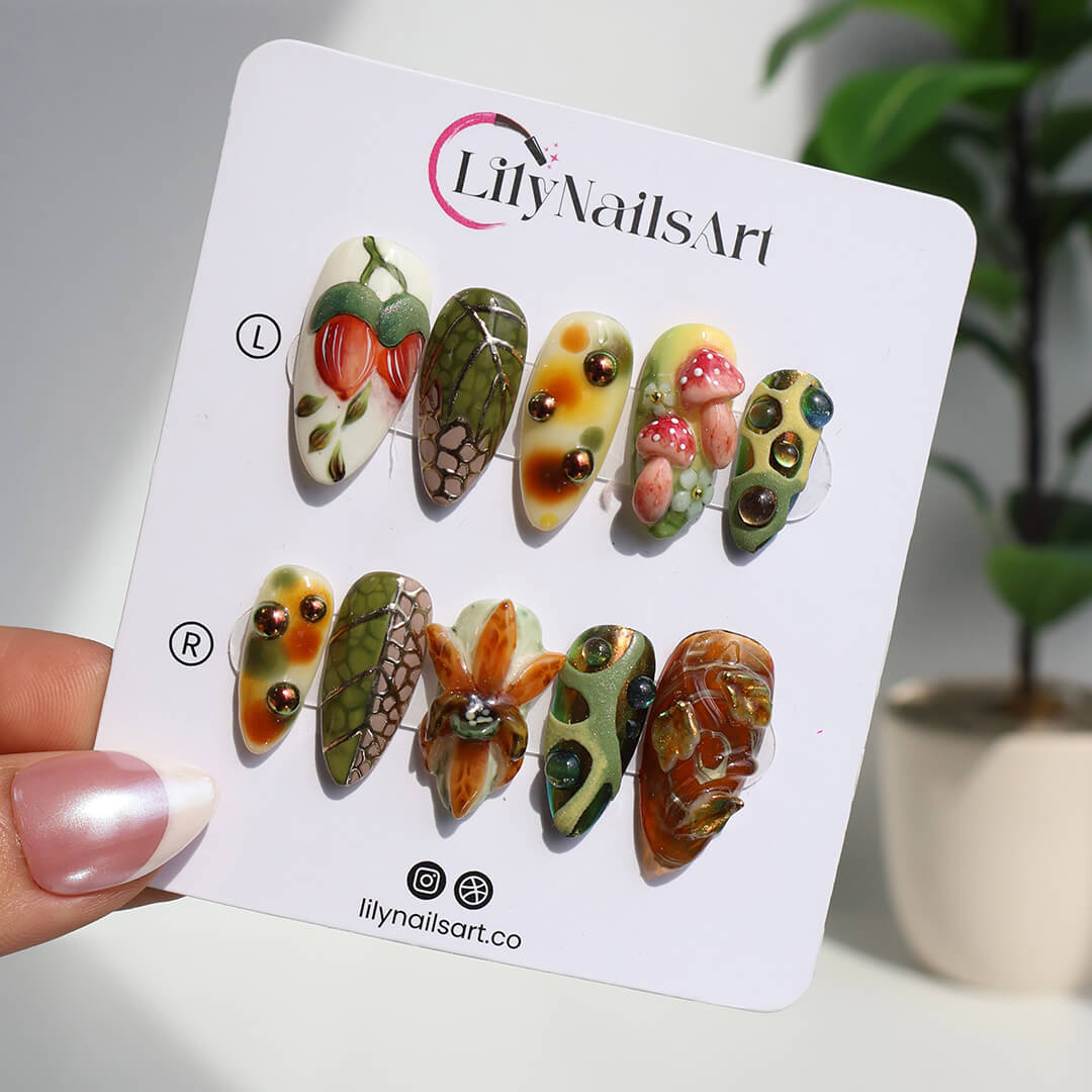 3D forest-inspired press-on nails with sculpted mushrooms, fruits, metallic leaves, and organic earthy textures in amber, moss green, and deep brown tones — luxury handmade long almond nails — perfect for autumn styles, enchanted woodland looks, or mystical nail art for fall