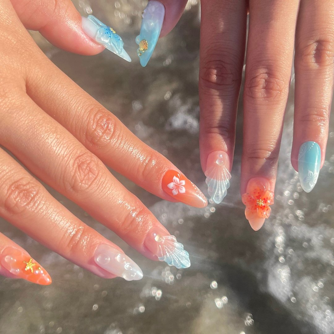 Handmade Tropical Ocean Press-On Nails – vibrant blue and coral tones with 3D seashells, flowers, starfish, and pearl accents. Perfect for  summer holidays, birthdays, vacations, or as a unique gift for her.