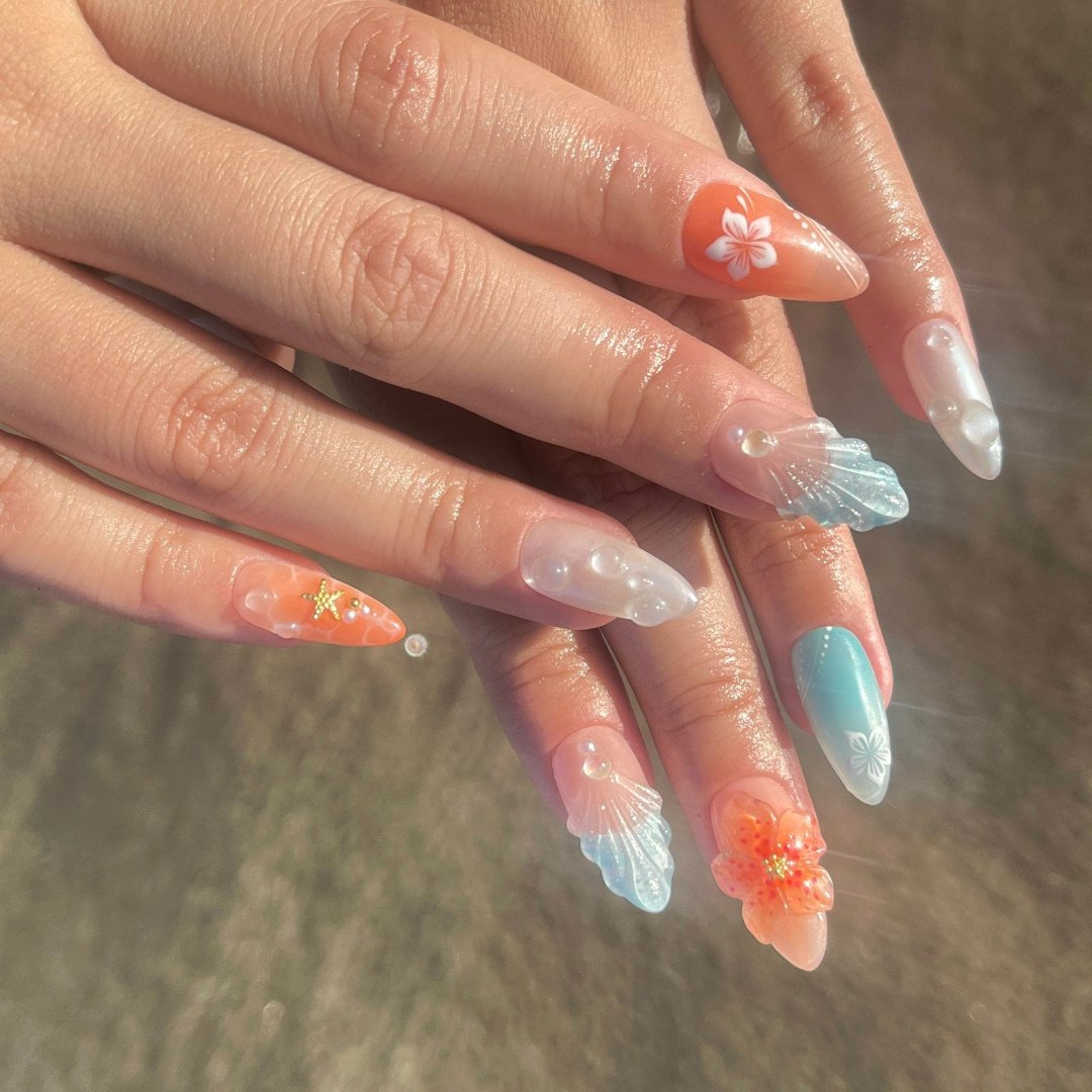 Handmade Tropical Ocean Press-On Nails – vibrant blue and coral tones with 3D seashells, flowers, starfish, and pearl accents. Perfect for  summer holidays, birthdays, vacations, or as a unique gift for her.