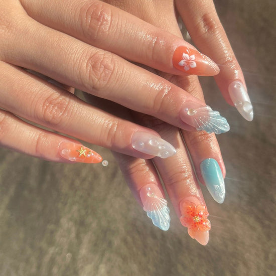 Handmade Tropical Ocean Press-On Nails – vibrant blue and coral tones with 3D seashells, flowers, starfish, and pearl accents. Perfect for  summer holidays, birthdays, vacations, or as a unique gift for her.