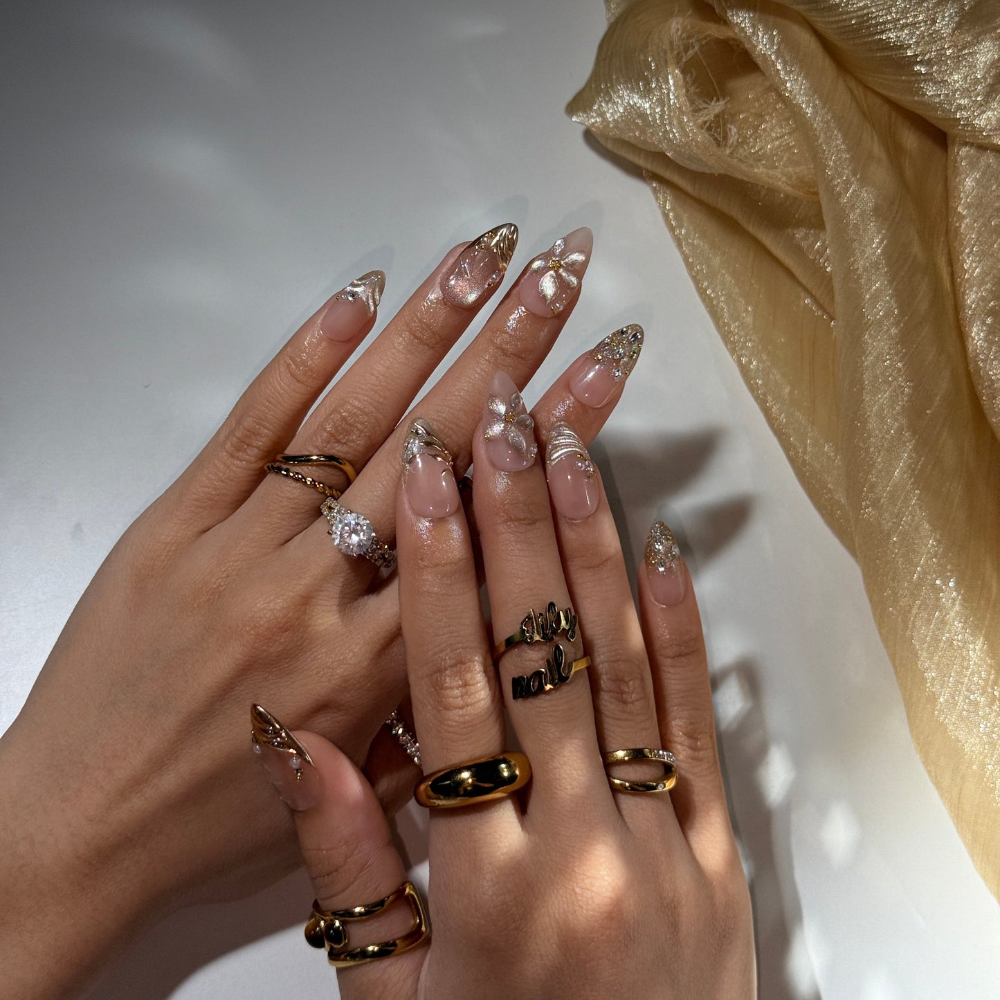 3D blush-to-gold shimmer press on nails with sculpted floral accents, embellished with crystals and pearls on a nude base — custom press on nails, luxury handmade nail art, fake nails, false nails, pressons — perfect for prom, galas, and special occasions
