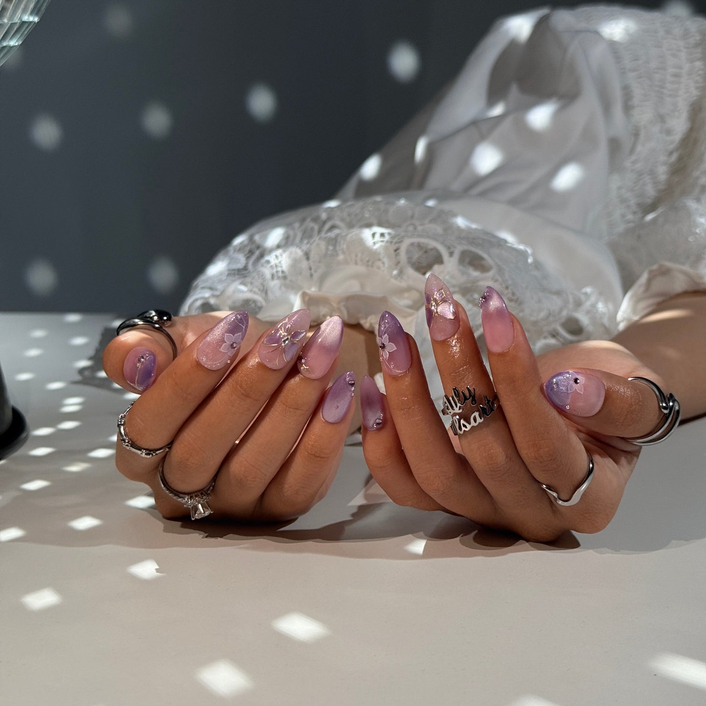 3D lavender ombré press on nails with gold butterfly motif, embellished with white floral accents and crystals — custom press on nails, luxury handmade nail art, fake nails, false nails, pressons — perfect for prom, spring events, and fairy-tale aesthetics