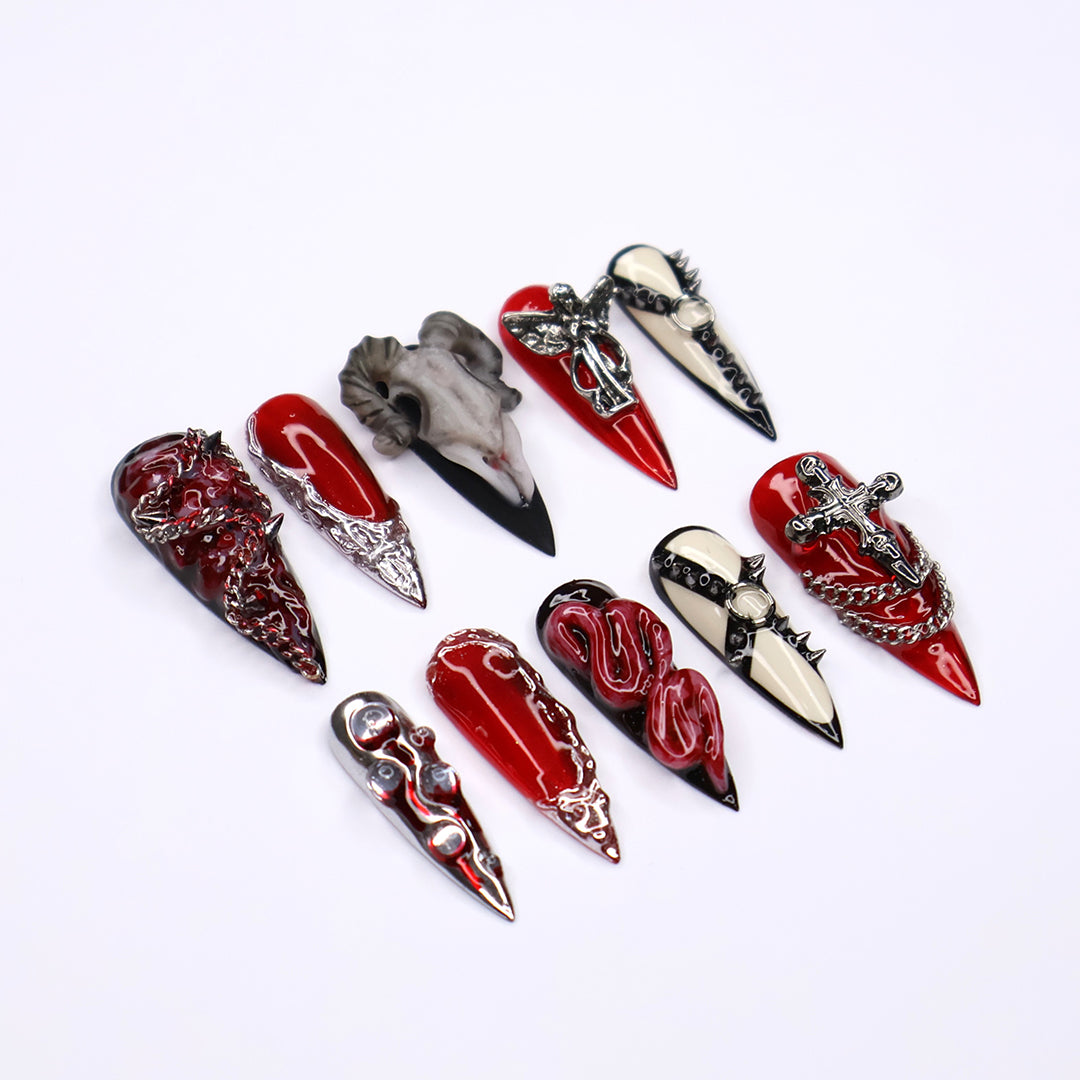 Red, black, and bone press on nails with gothic and horror-inspired 3D designs — handmade stiletto nails, custom press-ons, Halloween nail art, edgy fake nails — perfect for alt fashion, dark beauty looks, and statement nails.