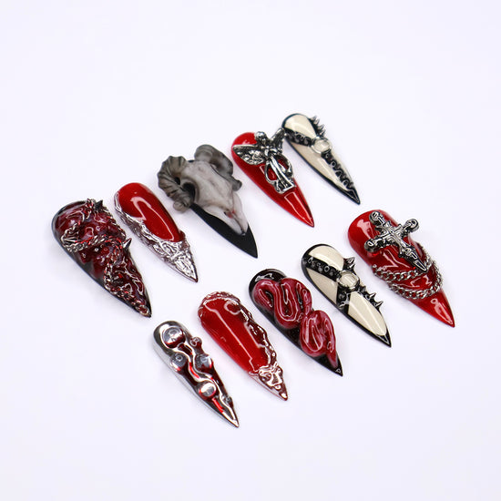 Red, black, and bone press on nails with gothic and horror-inspired 3D designs — handmade stiletto nails, custom press-ons, Halloween nail art, edgy fake nails — perfect for alt fashion, dark beauty looks, and statement nails.