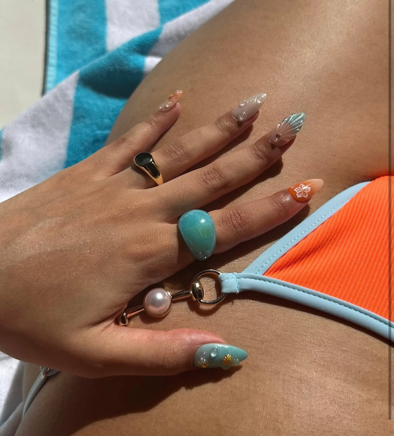 Handmade Tropical Ocean Press-On Nails – vibrant blue and coral tones with 3D seashells, flowers, starfish, and pearl accents. Perfect for  summer holidays, birthdays, vacations, or as a unique gift for her.
