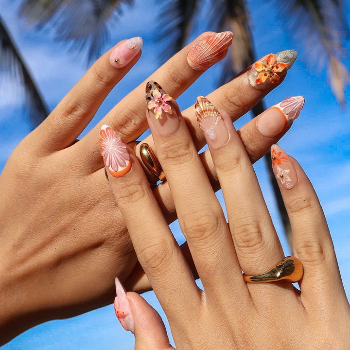 3D beach-themed summer press on nails with starfish, seashells, leopard print, and tropical flower accents, featuring soft pink and coral tones, gold glitter, and sculpted sea elements — summer vacation nails, ocean press on nails, custom handmade nail art, fake nails, false nails, pressons — perfect for tropical getaways, cruises, or summer gifting.