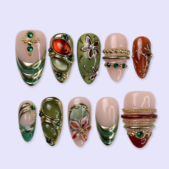 Chianti handmade fall press-on nails — fall almond set in nude, olive green and rust with amber and jade cabochons in ornate gold frames, 3D flowers, emerald gems and gold accents.
