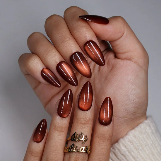 Brown Sugar handmade fall press-on nails — Medium almond set in rich caramel-brown with golden cat-eye shimmer, glossy molten finish and minimalist autumn nail art.