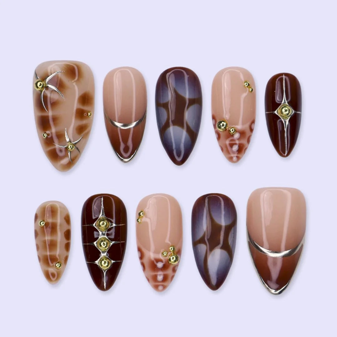 Bronze Era handmade press on nails in chocolate brown, mocha and nude with gold stars and French lines