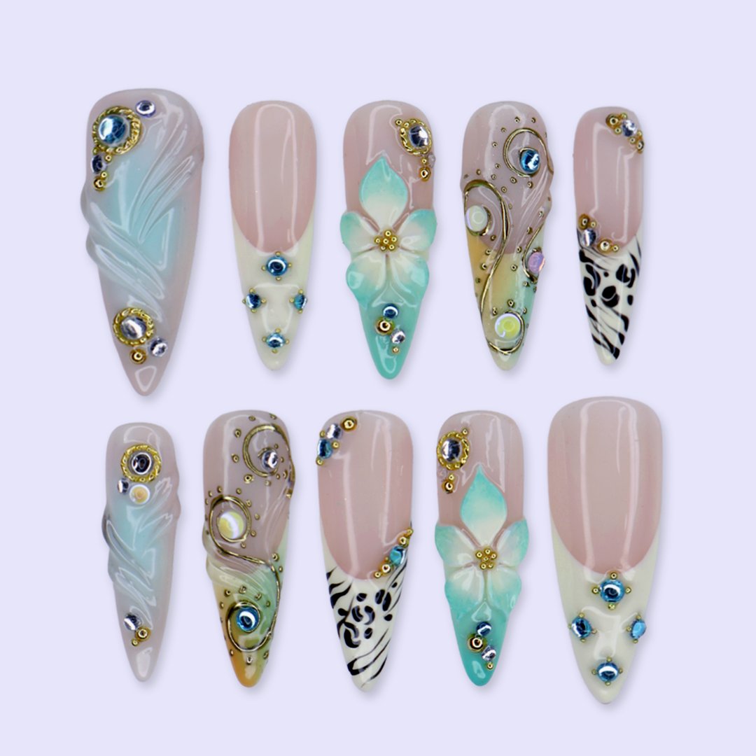 Handmade luxury summer stiletto press-on nails with aqua florals, 3D iridescent bloom, black animal print and gold crystal embellishments by Lily Nails Art