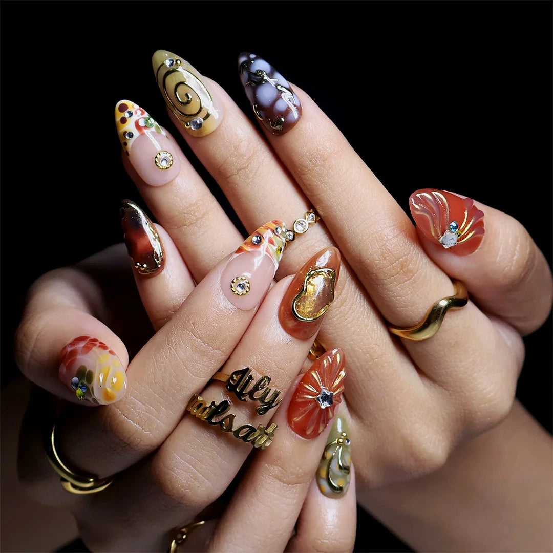 Caramel and gold almond press on nails worn on hand