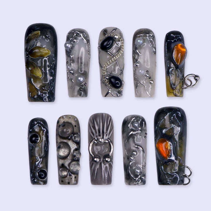 Alchemy gothic press on nails in smoky grey, black and olive with amber and onyx cabochons, silver hoops, chains and bubbling pearl textures — handmade Halloween press on nails, long square fake nails and witchy gothic nail art.