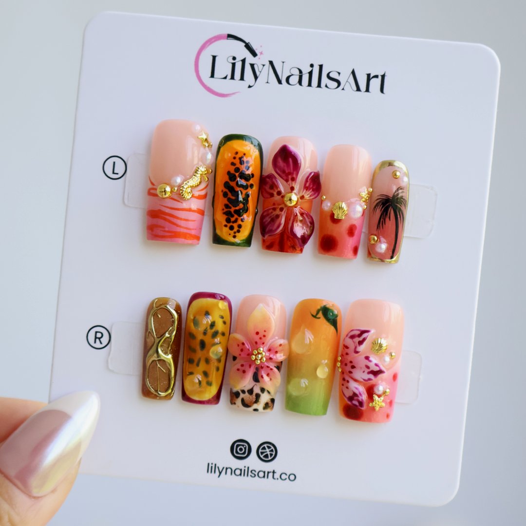 Handmade summer press-on nails with tiger lily blooms, leopard print and tropical fruit art by Lily Nails Art
