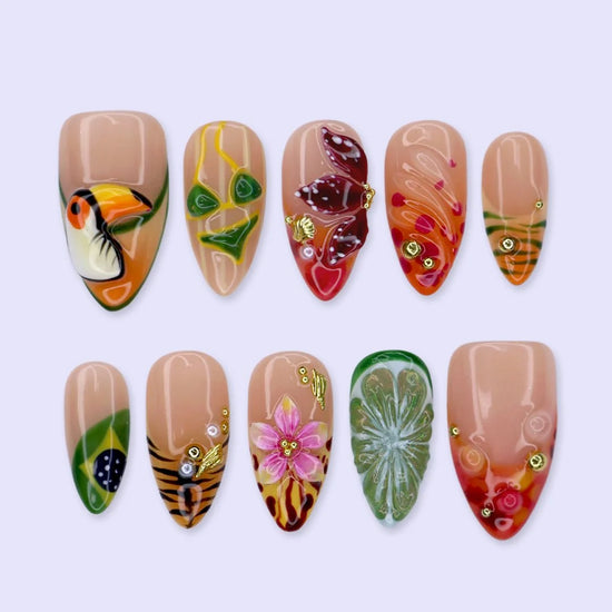 Handmade summer press-on nails with Brazil-inspired toucan, Brazilian flag, tiger stripes and tropical floral art by Lily Nails Art