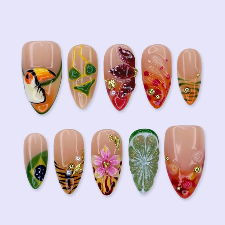 Handmade summer press-on nails with Brazil-inspired toucan, Brazilian flag, tiger stripes and tropical floral art by Lily Nails Art