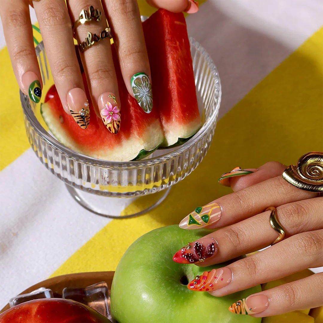 Handmade summer press-on nails with Brazil-inspired toucan, Brazilian flag, tiger stripes and tropical floral art by Lily Nails Art