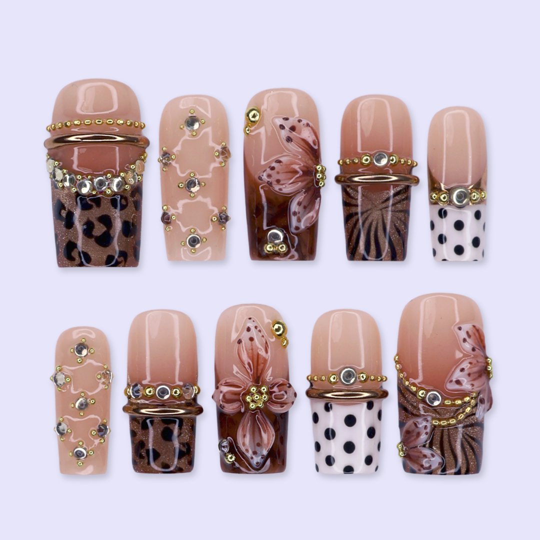 Coco handmade fall press-on nails — medium square set in nude and brown with leopard print, polka dots, 3D lilies and gold beading