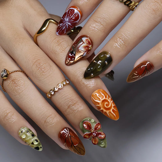 Wildwood handmade fall press-on nails — almond set in olive green, rust and terracotta with 3D dragonfly, ladybugs, orchids and gold leaf-vein linework