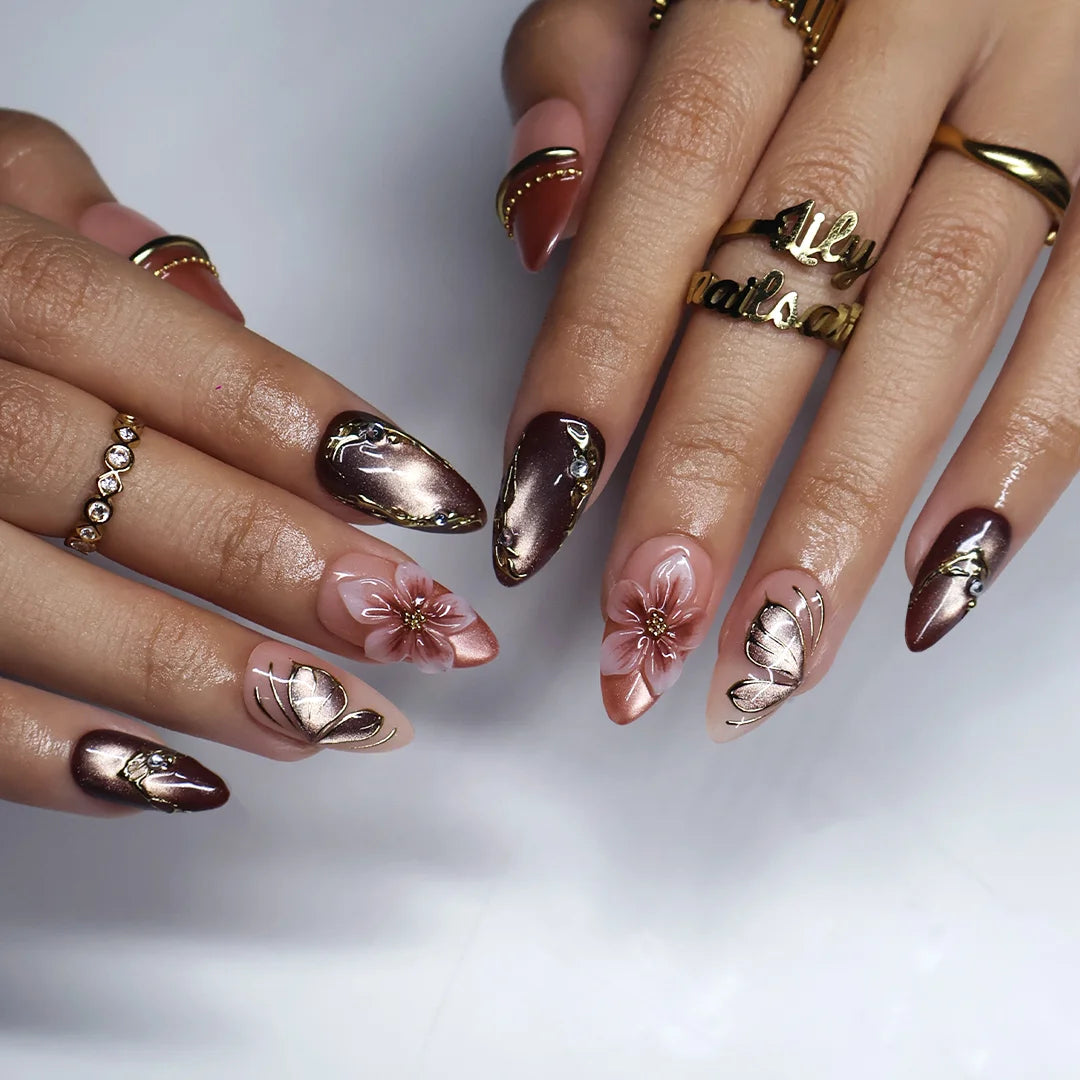 Papillon handmade fall press-on nails — almond set in nude, mauve and chocolate cat-eye with 3D pink lilies and gold butterfly-wing linework