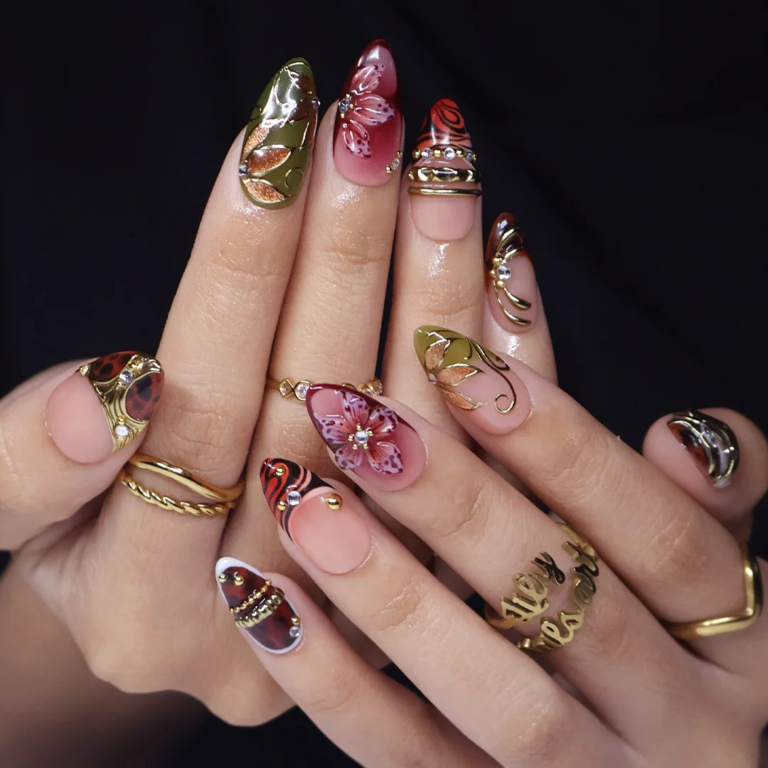 Harvest handmade press-on nails — maximalist medium almond set in nude, olive, rust and tortoiseshell with 3D pink lilies, gold leaves and gems