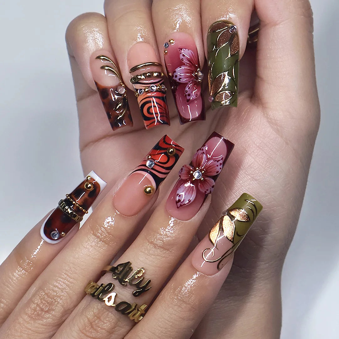 Harvest handmade press-on nails — maximalist long square set in nude, olive, rust and tortoiseshell with 3D pink lilies, gold leaves and gems
