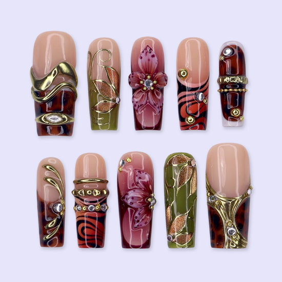 Harvest handmade press-on nails — maximalist long square set in nude, olive, rust and tortoiseshell with 3D pink lilies, gold leaves and gems
