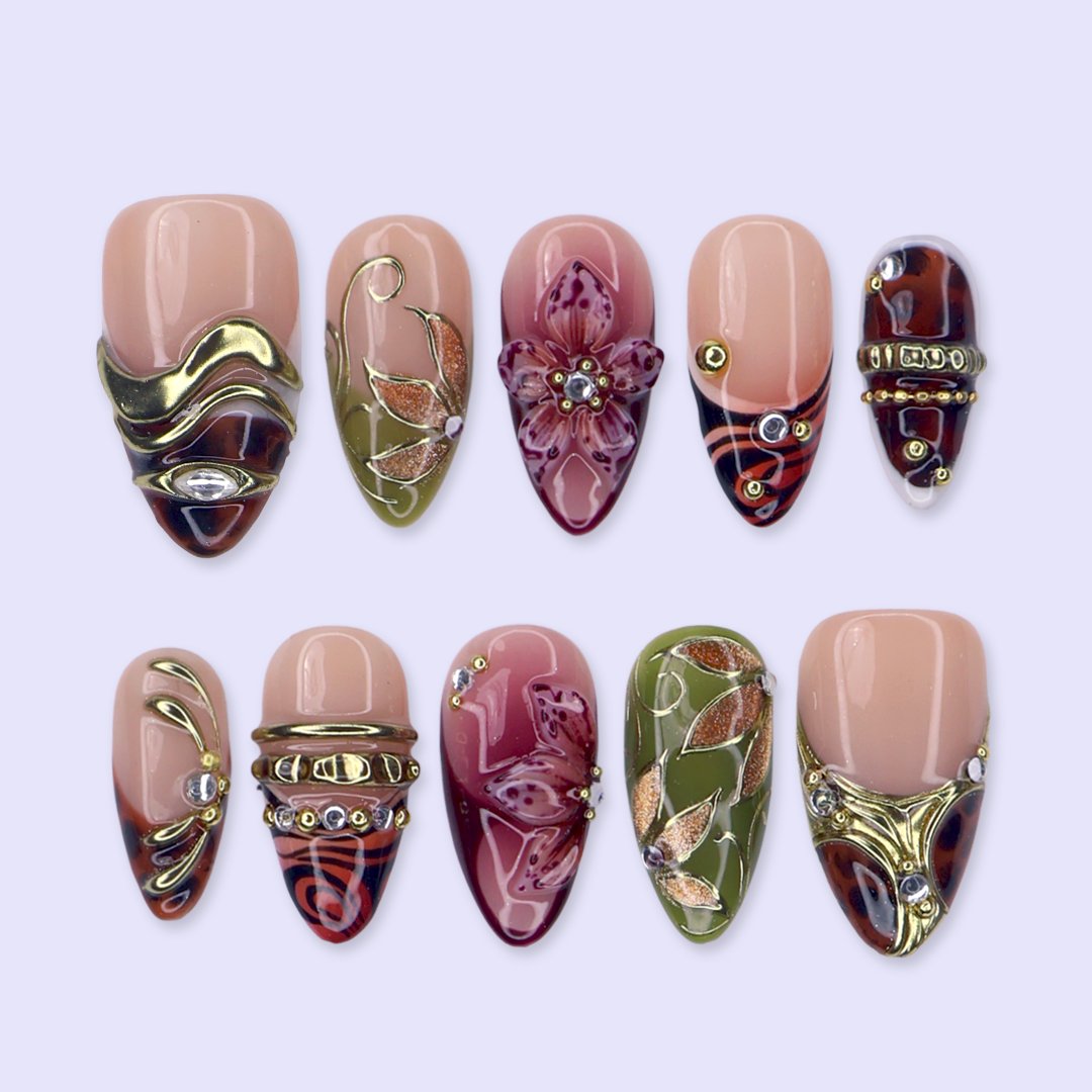 Harvest handmade press-on nails — maximalist medium almond set in nude, olive, rust and tortoiseshell with 3D pink lilies, gold leaves and gems