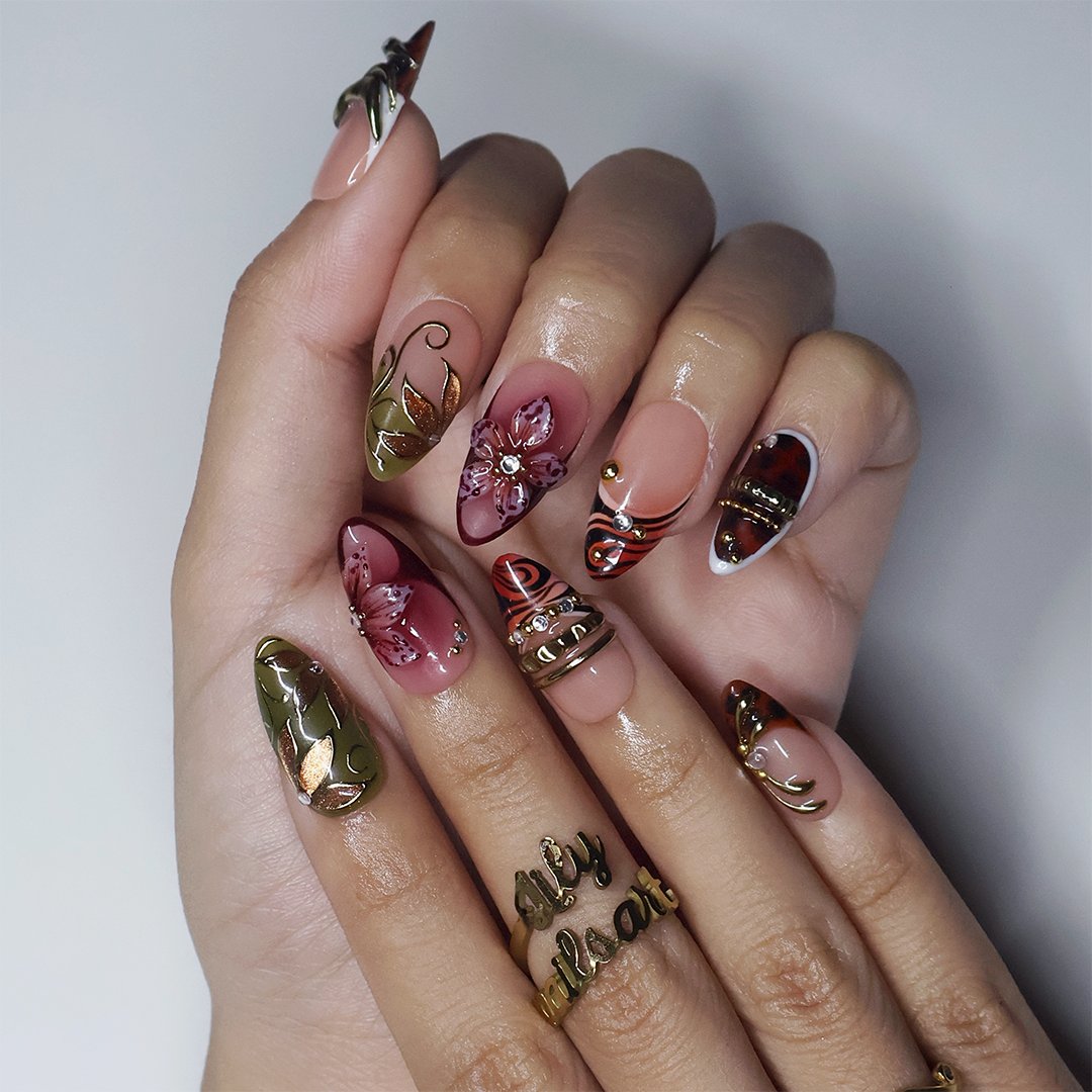 Harvest handmade press-on nails — maximalist medium almond set in nude, olive, rust and tortoiseshell with 3D pink lilies, gold leaves and gems