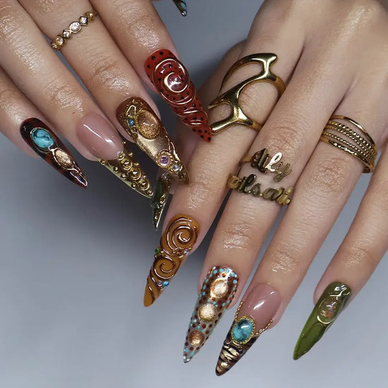 Bijou handmade maximalist press-on nails — long almond set in nude, caramel and olive with jade and turquoise cabochons in gold frames, spirals and beadwork
