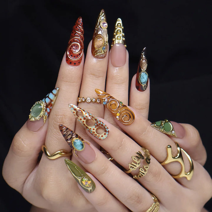 Bijou handmade maximalist press-on nails — long almond set in nude, caramel and olive with jade and turquoise cabochons in gold frames, spirals and beadwork
