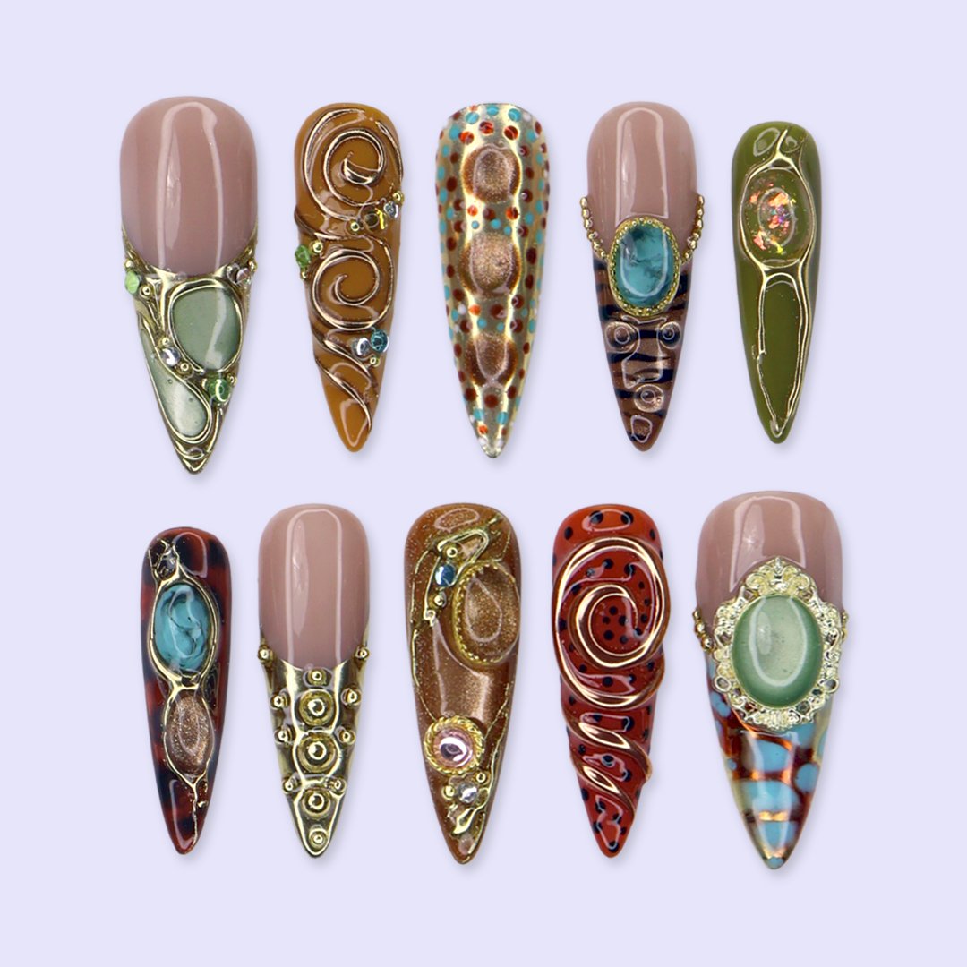 Bijou handmade maximalist press-on nails — long almond set in nude, caramel and olive with jade and turquoise cabochons in gold frames, spirals and beadwork
