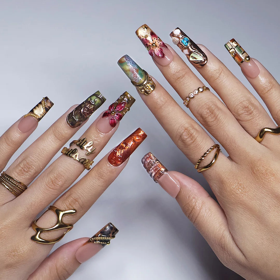 Oasis handmade maximalist press-on nails — long square set in nude, olive and copper with abalone shell, turquoise cabochons, 3D lilies and gold chains