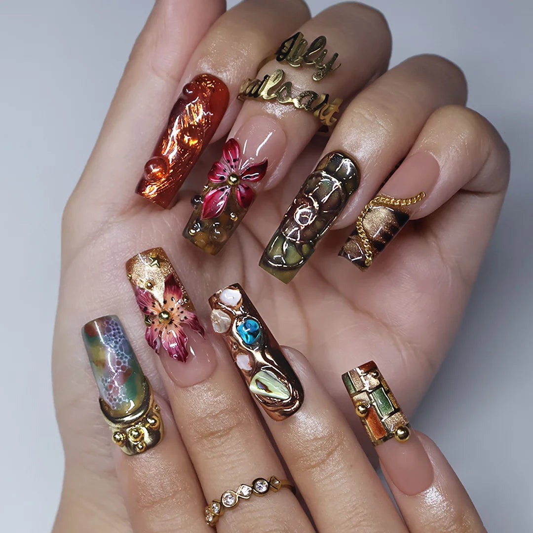 Oasis handmade maximalist press-on nails — long square set in nude, olive and copper with abalone shell, turquoise cabochons, 3D lilies and gold chains