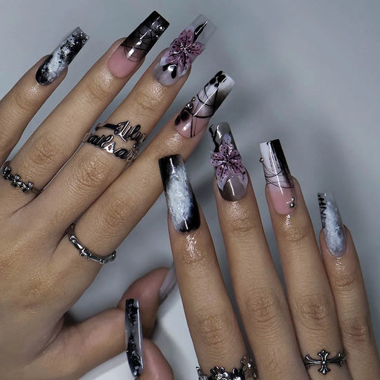Belladonna gothic press on nails in smoky black and grey over nude with abstract ink marbling, delicate linework and 3D mauve-pink lilies — handmade Halloween press on nails, long square fake nails and gothic nail art.