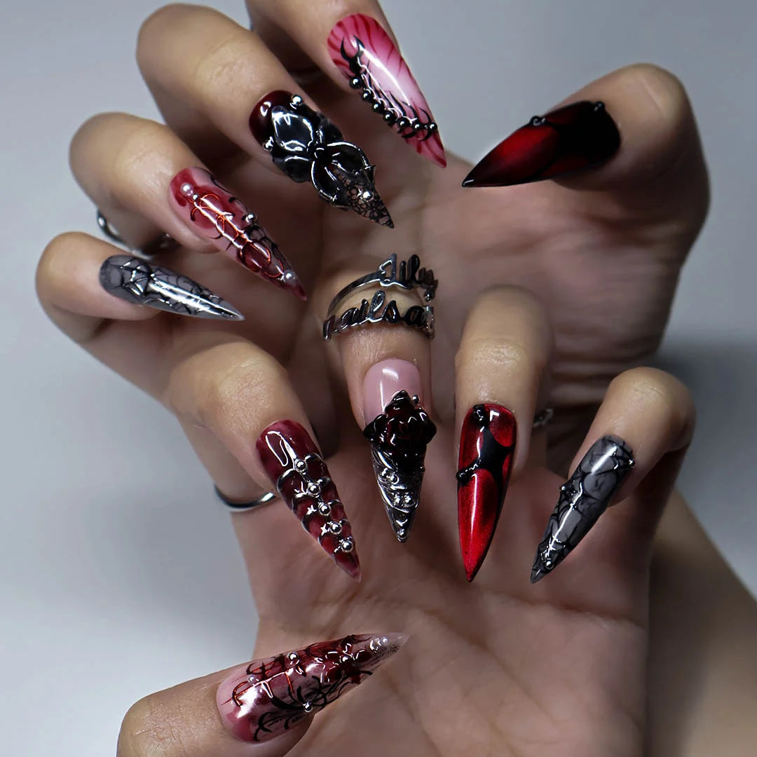 Velvet Bite gothic press on nails in blood red, black and smoky grey with a 3D spider, spiderwebs, black rose, silver studs and thorny vines — handmade Halloween press on nails, long stiletto fake nails and vampire gothic nail art.