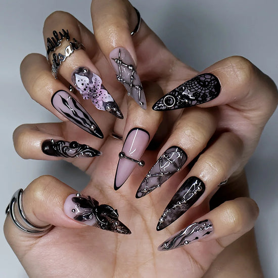 Enigma gothic press on nails in smoky mauve-grey, black and nude with silver piercings, chain lattice, black lace, baroque swirls and a 3D purple lily — handmade Halloween press on nails, long stiletto fake nails and gothic nail art.