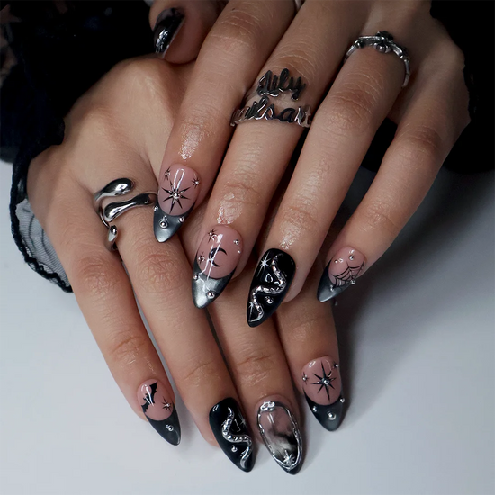 Eclipse gothic Halloween press on nails in nude, smoky black and silver chrome with a 3D snake, spiderwebs, bat, stars and crescent moon — handmade designer press on nails, medium almond fake nails and celestial witchy nail art.