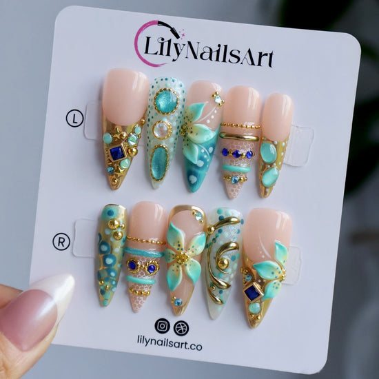 Handmade summer press-on nails — maximalist long almond set  in tiffany blue with sapphire gems, gold filigree and aqua 3D lilies
