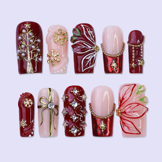 3D red & nude press on nails in medium square with christmas tree, gold charms, snowflakes, and poinsettia details — luxury handmade false nails, reusable press ons for holiday, Christmas party, and festive gifts