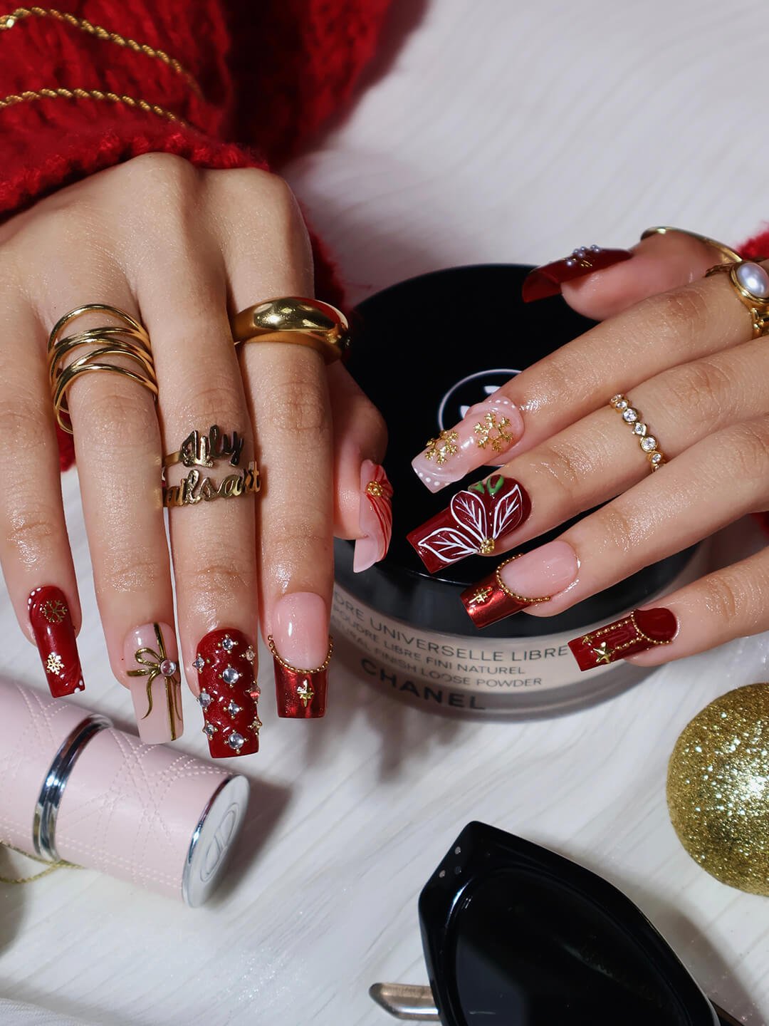 3D red & nude press on nails in medium square with christmas tree, gold charms, snowflakes, and poinsettia details — luxury handmade false nails, reusable press ons for holiday, Christmas party, and festive gifts