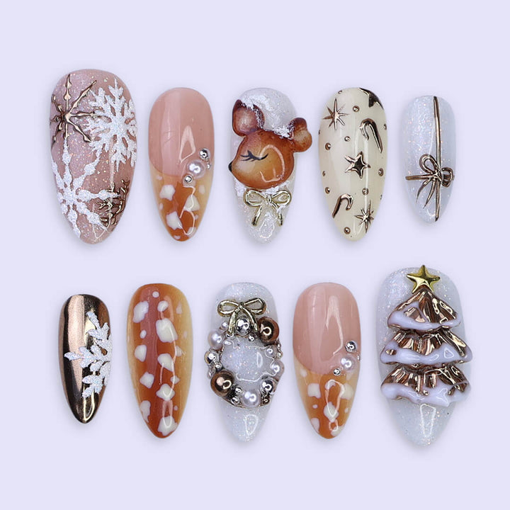 3D holiday press on nails in nude, caramel, and white with reindeer art, candy cane swirls, Christmas tree charms, metallic gold details — luxury handmade Christmas nails, reusable false nails, festive nail art — perfect for winter parties, holiday gifts, or cozy glam nights.
