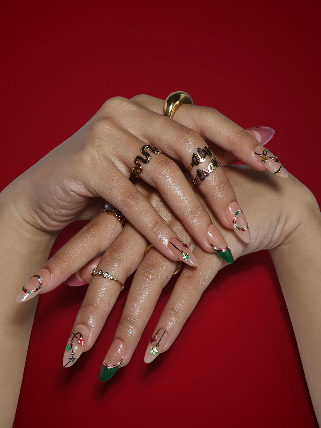 3D Christmas press on nails with red and green French tips, embellished with star garlands, metallic charms, and hand-painted snowflakes — festive holiday fake nails, reusable false nails, handmade nail art, custom pressons for winter, party or gift ideas