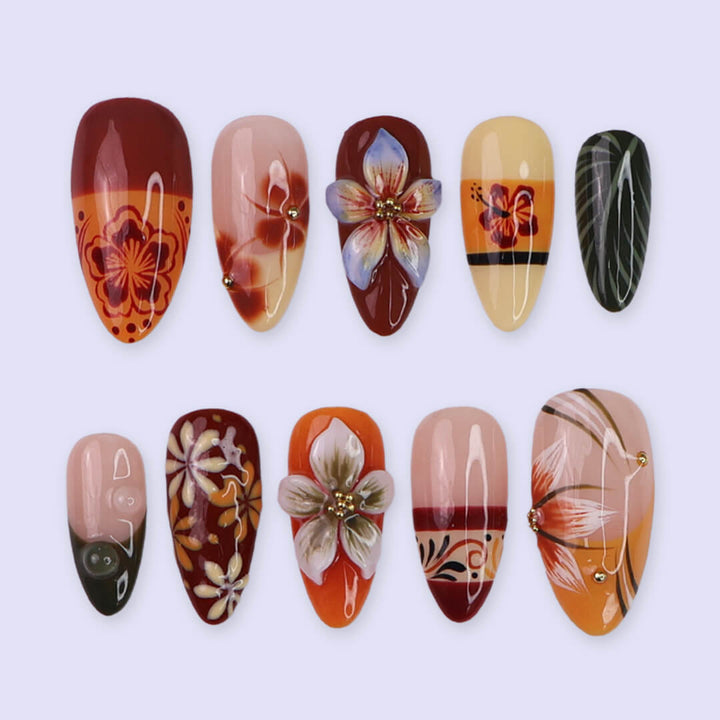 Fall inspired press-on nails with hibiscus flowers, tropical leaf accents, and gradients of red, orange, and golden tones — luxury handmade medium almond nails inspired by Tahitian sunsets and glowing embers — perfect for fall look, holiday 