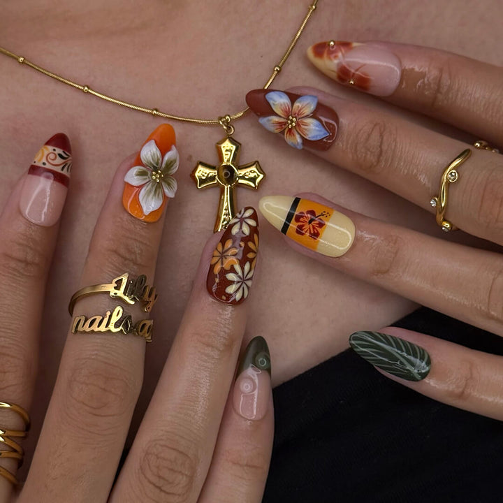 Fall inspired press-on nails with hibiscus flowers, tropical leaf accents, and gradients of red, orange, and golden tones — luxury handmade medium almond nails inspired by Tahitian sunsets and glowing embers — perfect for fall look, holiday 