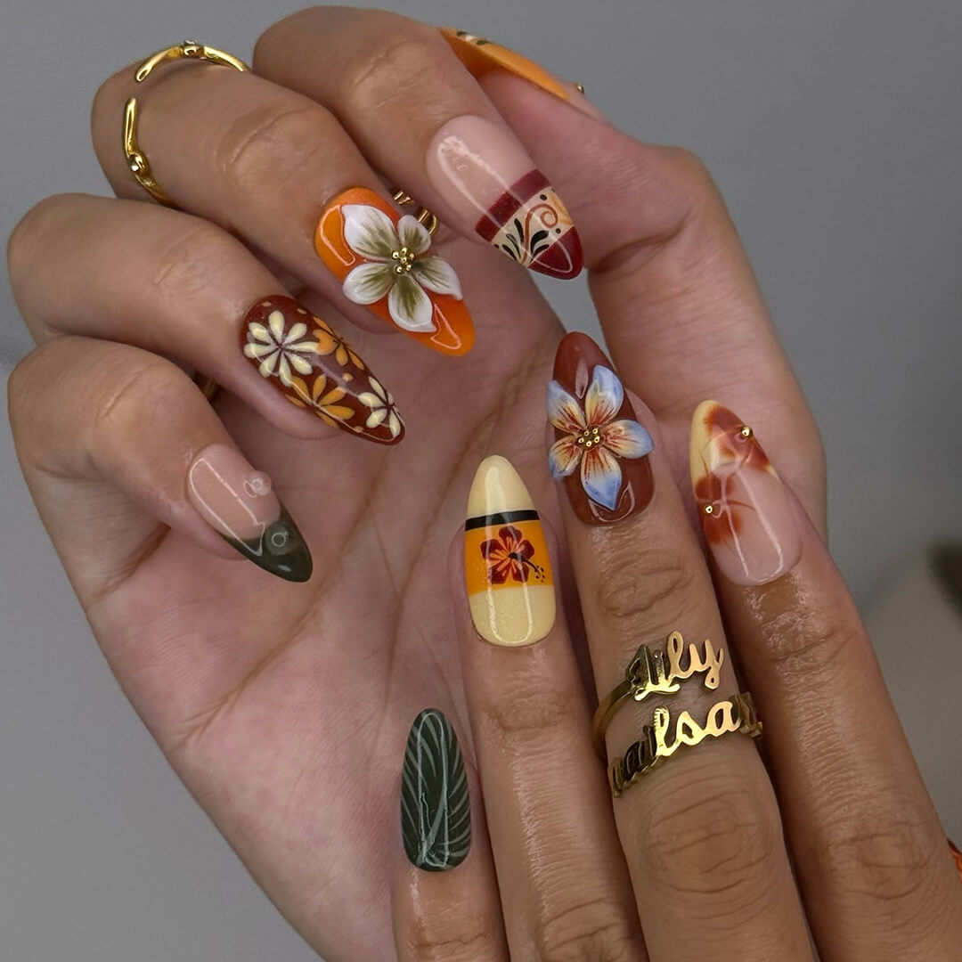 Fall inspired press-on nails with hibiscus flowers, tropical leaf accents, and gradients of red, orange, and golden tones — luxury handmade medium almond nails inspired by Tahitian sunsets and glowing embers — perfect for fall look, holiday 