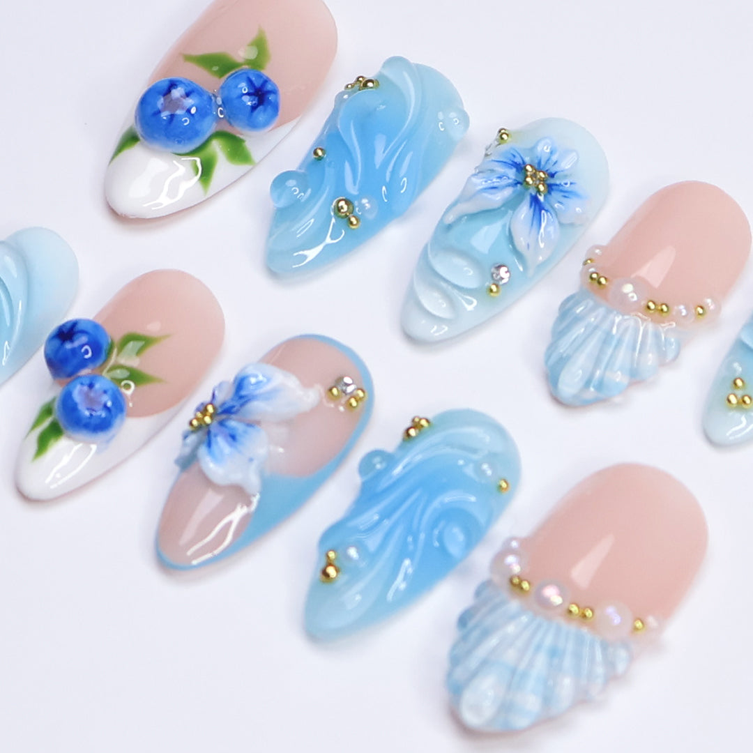 3D ocean blue press on nails with blueberries, sculpted flowers, and seashell accents — featuring glossy wave textures, pearl embellishments, and soft gradient blues — summer vacation nails, coastal press on nails, custom handmade nail art, fake nails, false nails, pressons — perfect for beach holidays, ocean-inspired looks, or gifting for her.