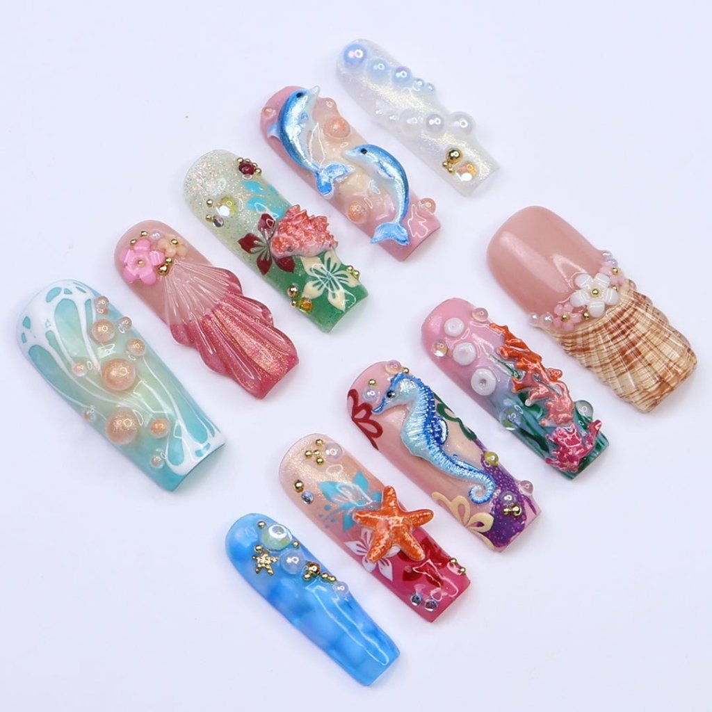 3D ocean press on nails with dolphins, seahorse, starfish, coral reef, and tropical flowers — featuring vibrant colors, glitter seashells, pearl bubbles, and sculpted textures — beach vacation nails, mermaid core press on nails, custom handmade nail art, fake nails, false nails, pressons — perfect for summer getaways, tropical looks, or gifting for ocean lovers.